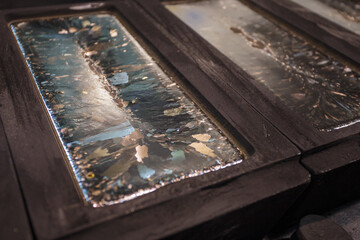 Molds with solidifying hot silver.