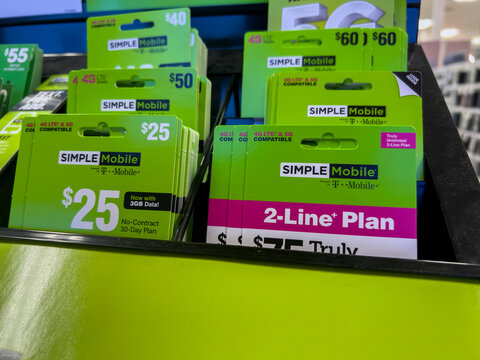 Seattle, WA USA - circa August 2022: Angled, selective focus on wireless phone carrier service cards for sale inside a Target store.
