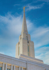 Vertical Whispy white clouds Low angle view of an LDS church against the clear sky in Utah