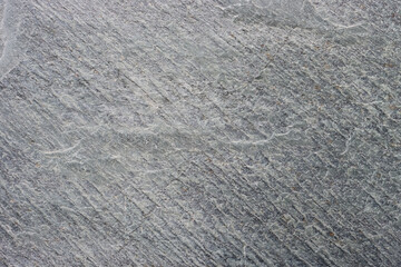 Gray stone wall for back. Abstract surface made of gray cement. Abstract surface made of gray cement.



