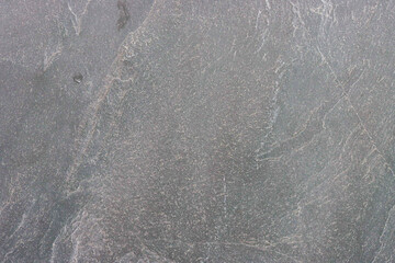 Gray old stone wall close up.
