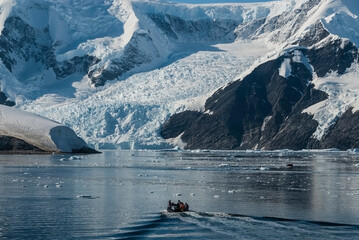 Tourists watching a glacier in Antarctica, near the Antarctic Peninsula.