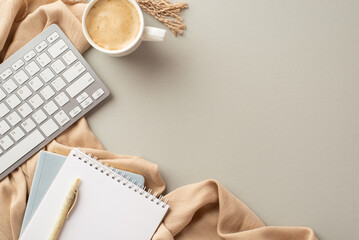 Autumn business concept. Top view photo of workstation notebooks pen keyboard cup of coffee and scarf on isolated grey background
