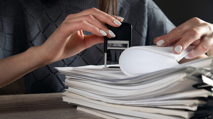 woman hand with stamping documents