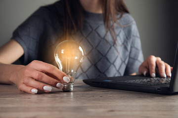 woman Hand holding Light bulb Global Internet connection