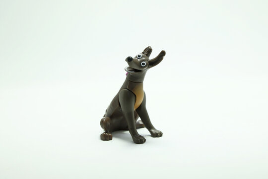 Xoloitzcuintle dog from the Pixar movie, Coco. Dante is Miguel's pet. Children's toy figure. Character from the Disney Pixar film. Isolated white. Domestic animal. 
