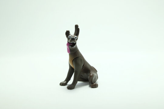 Dante. Xoloitzcuintle dog from the Pixar movie, Coco. He is Miguel's pet. Children's toy figure. Character from the Disney Pixar film. Isolated white. Domestic animal. McDonald's happy meal toy.