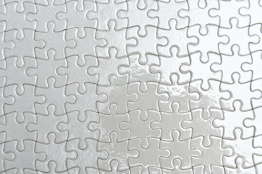 white paper puzzle with glossy foil