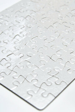 white paper puzzle with glossy foil