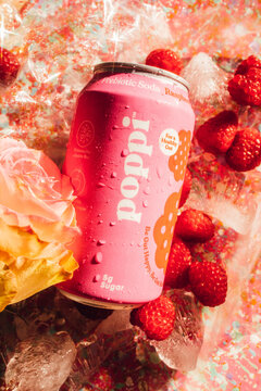 Pink 12 Oz Can Of Poppi Prebiotic Soda Raspberry Rose