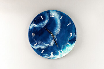 Round wall clock with ocean shore pattern. Vacation time concept. Time for rest and lunch....