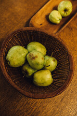 small heritage green apples freshly picked from tree on brown