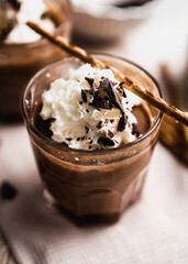 chocolate cake with coffee 
chocolate mousse cream in a glass cup on a white background with...