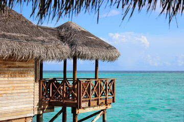 Maldives wooden pier pathway water villas luxury holiday ocean