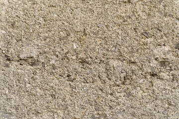 Concrete or sandy gray fence surface. solid background