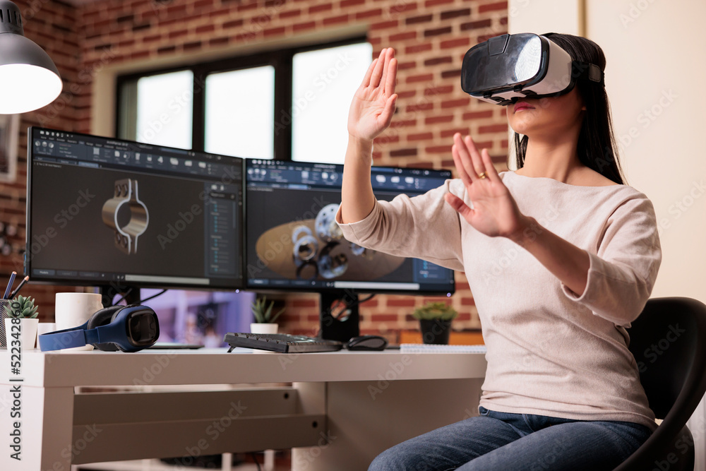 Poster engineer using vr glasses to manufacture gears product with virtual reality technology and cad softw