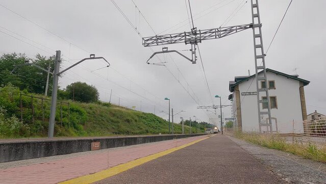 Freight locomotive of the Renfe company with diesel traction pulling wagons of dangerous goods, entering Os Peares station in Galicia