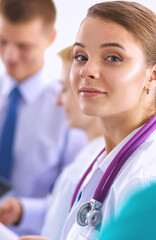 Woman doctor standing with stethoscope at hospital
