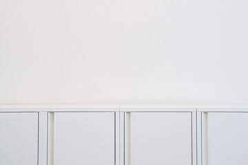 Modern white cabinet on a white background.