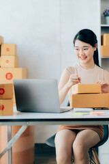 Asian teenager owner business woman work at home for online shopping and sale