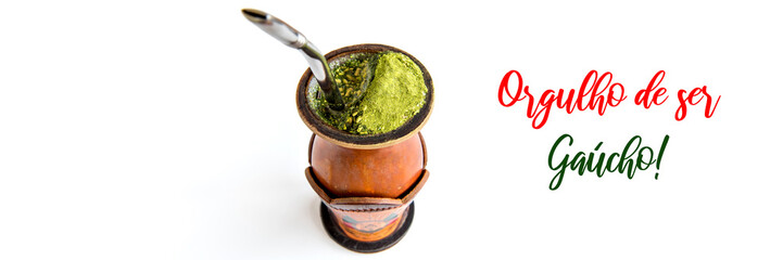 Traditional yerba mate tea, chimarrão gaucho from southern Brazil, outdoor format white background.