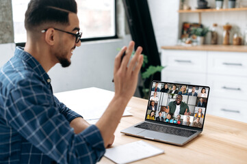 Group brainstorm, online video meeting, virtual conference with multiracial colleagues. Mixed race...