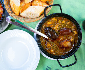 Traditional dish of Asturian cuisine Pote asturiano - thick stew with vegetables and beans added...