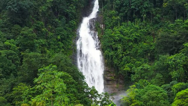 Aerial view of Mapalana Falls in green forest. Waterfall in the tropical mountain jungle. Sri Lanka.