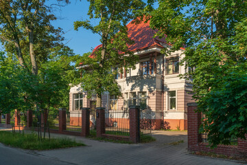 Fototapeta premium Kaliningrad, Russia, 06.28.2022: View of a villa Aron in the historic district of Amalienau (former prestigious suburb of Koenigsberg) on a sunny summer day