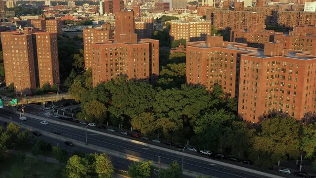 Cinematic aerial rise over Harlem housing project r