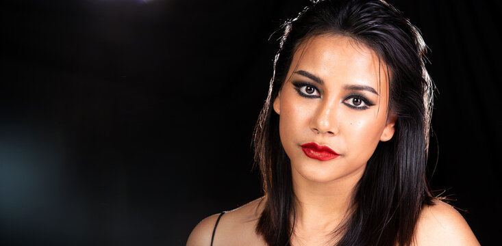 Indian Tanned Skin Asian Woman show face make up with backlit light and water splash spray