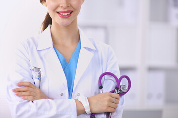 Medical team sitting at the table in modern hospital