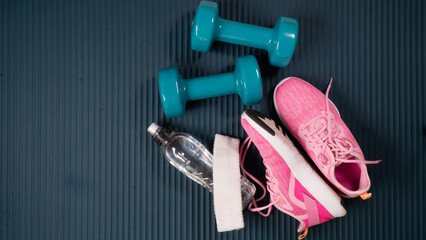 Gym workout kit - dumbbells with sneakers, bottle of water, towel and Buff