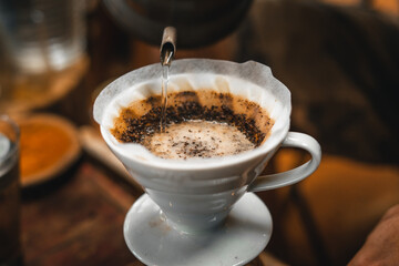 Closeup of hands barista make coffee