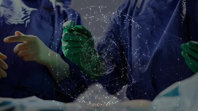 Animation of globe of network of connections over team of surgeons performing operation at hospital
