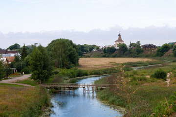 Sudal, Russia - August 07, 2022. Wooden bridge over the river Kamenka in the ancient Russian city of Suzdal.
