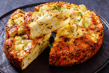 Cauliflower Cake with cheese, basil, top view