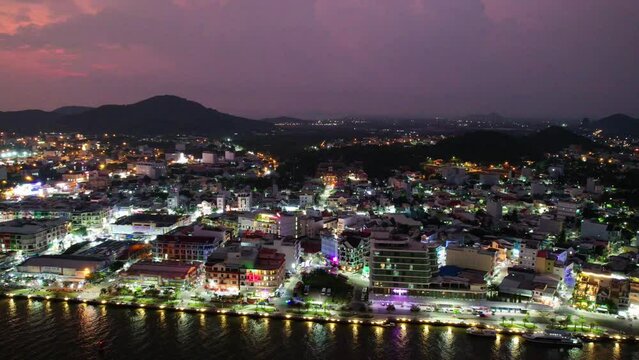 Time lapse aerial view of night Ha Tien town, Kien Giang, Vietnam, this is central crowded and bustling in Kien Giang, Vietnam.