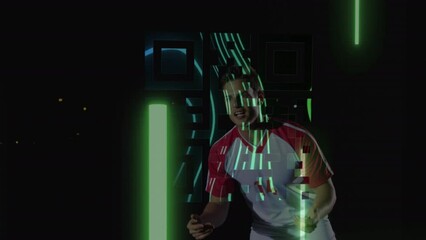 Animation of neon qr code over caucasian male soccer player heading the ball on black background - Powered by Adobe