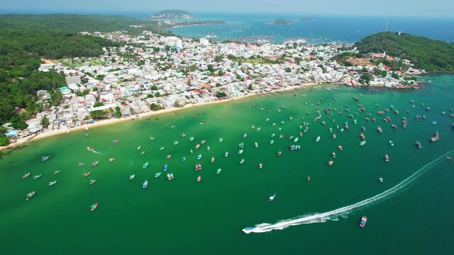 Aerial View Of Wooden Fishing Boat On Sea and An Thoi town In Phu Quoc Island, Vietnam.