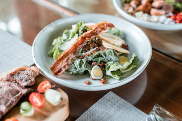 Green vegan salad from green leaves mix and vegetables.
