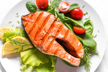 Grilled salmon steak with vegetable salad