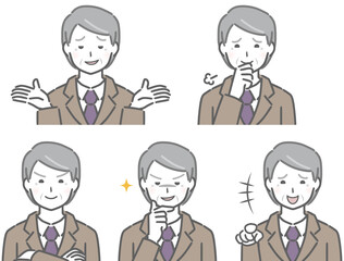 嫌な表情のスーツの高齢男性