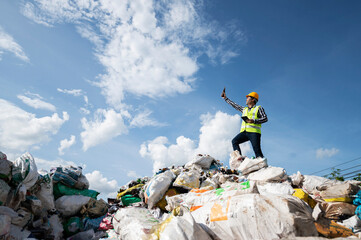 ecological engineering standing on the mountain rubbish big pile of garbage degraded waste A pile...