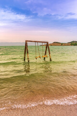 Fototapeta premium Old swings on Lake Sevan. Armenia