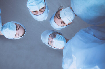 Team surgeon at work in operating room.