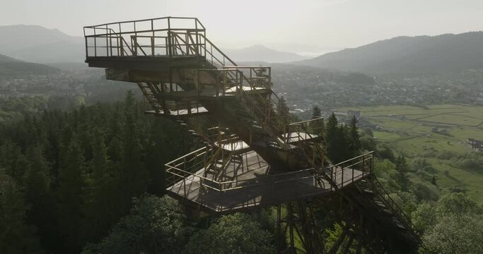 Revolve Around Abandoned Ski Jump Overlooking Tranquil Ski Resort Of Bakuriani In Georgia. Aerial Drone