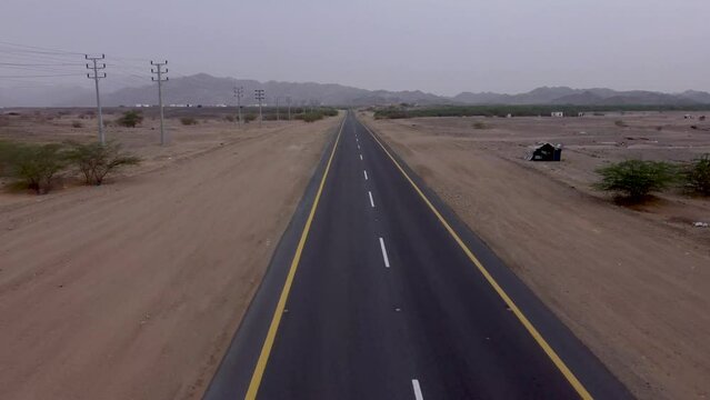 Aerial flying over deserted road outskirts Al Lith hot spring, Saudi Arabia