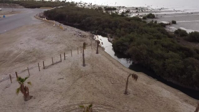 Aerial flying over a beach cabin restaurant into Arabian Gulf at Qatif Tarout Bay