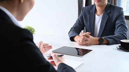 Female financial advisor explaining investment plan to young start up businessman 